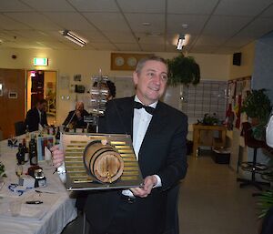 Station Leader, Mark, with a marvellous midwinter gift from the rest of the team, crafted by Mike down in the workshop at midwinter dinner