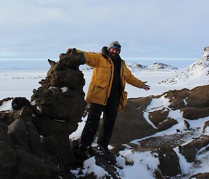 Mark Grainger at Browning Peninsula surrounded by rocks and snow