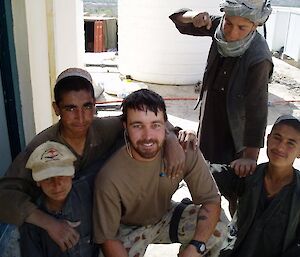 Jeremy Browne with local children in Afghanistan