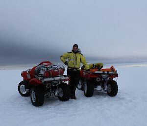 Dan with our transport — two quad bikes