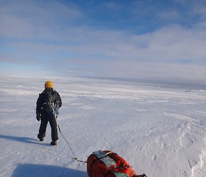 Gavin hauling his sled across the ice