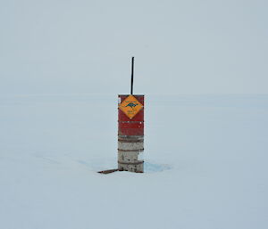 Drum stack marking a waypoint on a hut route