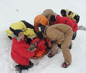 After dealing with the immediate problems it’s all hands on deck to get Phill packaged up onto the stretcher