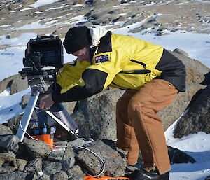Andy doing penguin camera maintenance