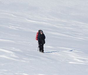 Bri walking across one of the snow filled saddles towards the west of the island