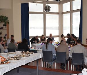 Everyone seated at end of winter dinner at Casey