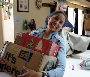 Expeditioner looking happy with Christmas gifts