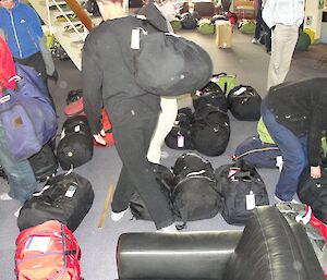 Expeditioners’ bags in the wallow waiting to be claimed