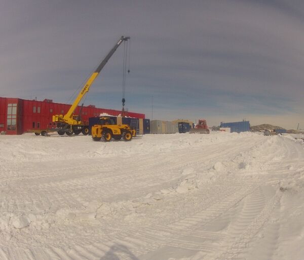 East wing containers lined up in front of the red shed