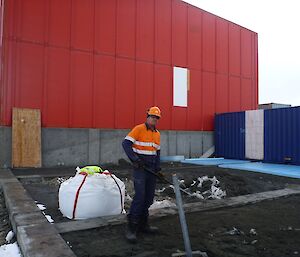 Projects Building Services Supervisor Matt Morley preparing the ground to receive the next container