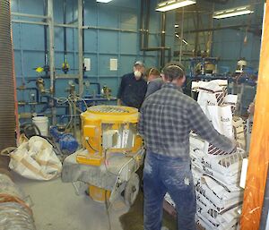 Bob, Rob and Kenny mixing the grouting cement