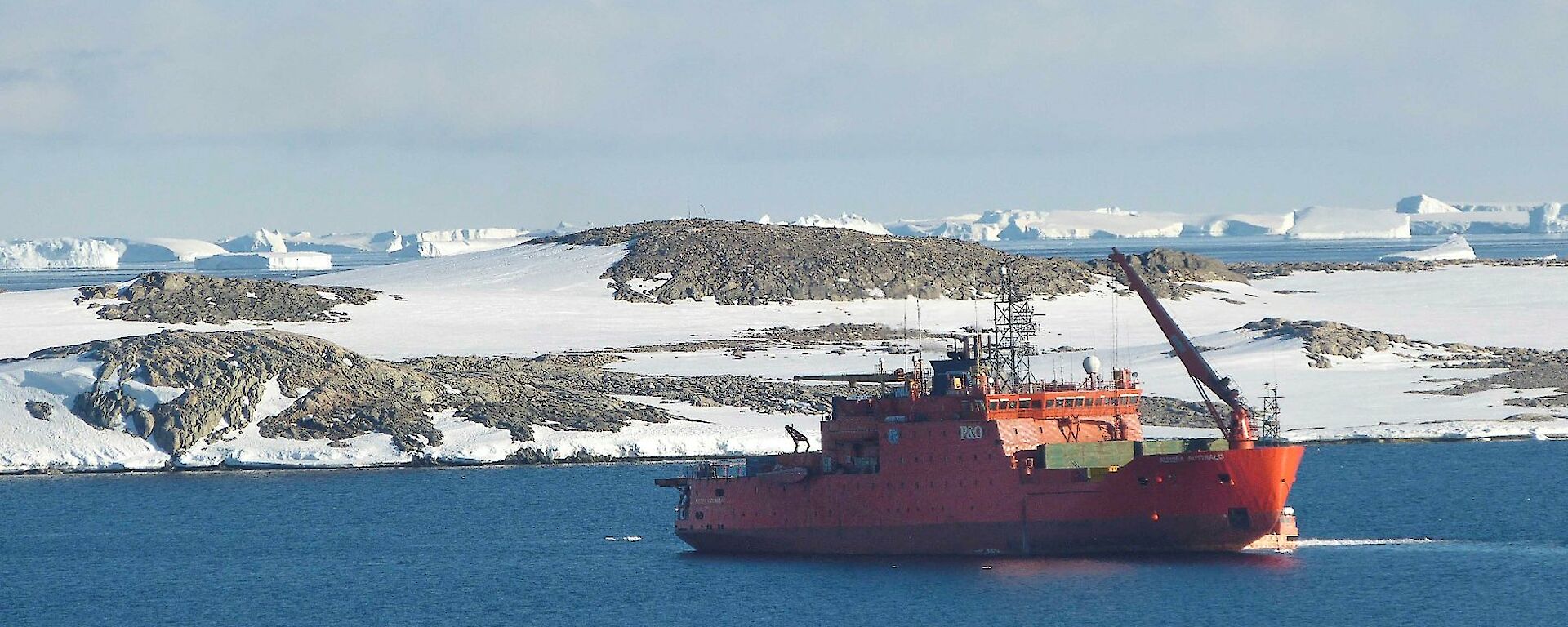 The Aurora Australis on anchor in the bay in front of the station