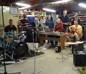 Band rehearsing in the emergency vehicle shelter