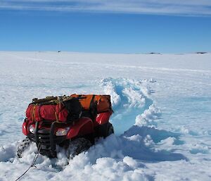 A quad bike being recovered after being bogged in melted ice