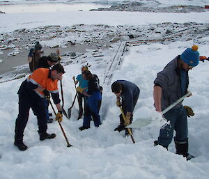 More of the French expeditioners digging to expose the cable trays