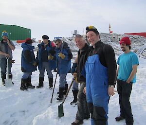 French expeditioners posing with shovels on hand