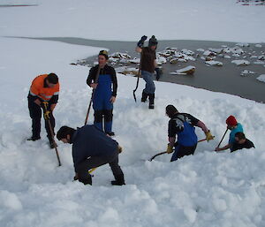 More French volunteers digging up cable trays