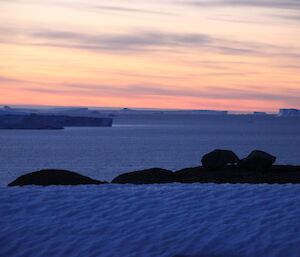 Sunrise over the icebergs and glacier