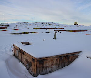 Old structures in Wilkes nearly covered by snow