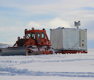 Another view of the D7 dozer towing the Silver Chalet