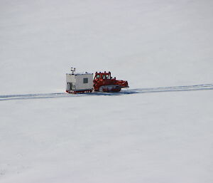 Another view of the D7 dozer towing the Silver Chalet