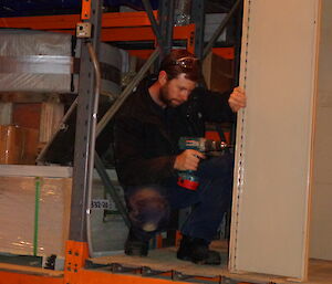 Aaron breaking down the shelving