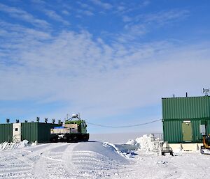 Buildings on sleds with blizzard trails