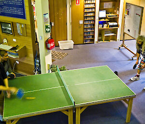 Leon and Tim playing against Michael and Matty in match of table tennis