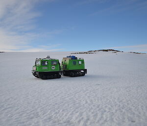 Picture of a green Hagglund on snow covered terrain