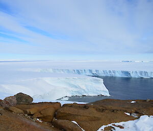 View overlooking the Vanderford Glacier on a high point, with rocky foreground