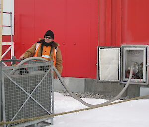 Mark filling up a 1000 litre tank with water