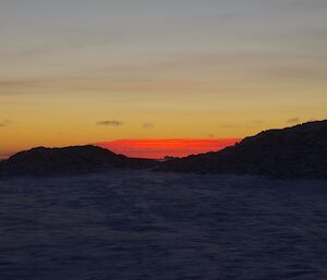 Sunset red colours reflecting of a low cloud