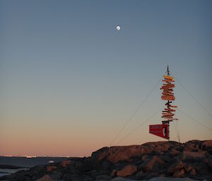 A picture of the moon at 7am in the background and Casey sign in the foreground