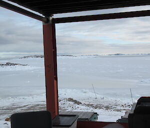 View of Newcomb bay half covered by sea ice in a cold snowy day