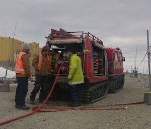 Fire team operating a Red Hagg with fire fighting water pump