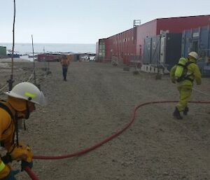 Fire team organising water hose