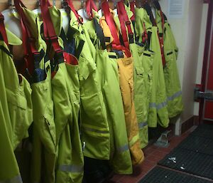 A cold porch with fire fighting gear hanging of a rack