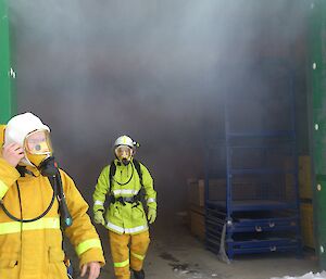 BA team leaving a smoke filled green building