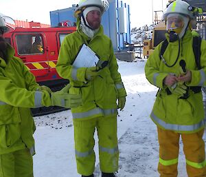 Red fire Hagg in the background with three members of the fire team one wearing BA