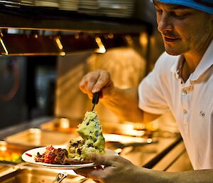 Chad filling his plate with food