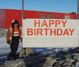 Mark inspecting the new sign