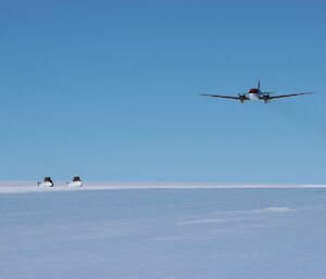 A aircraft landing with Dozer in the background