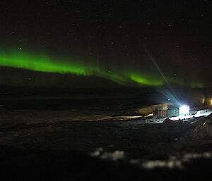 Green aurora over a night sky