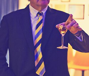 Allan doing a Bond Martini pose, with a Martini on hand