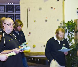 Other expeditioners standing following the ANZAC program