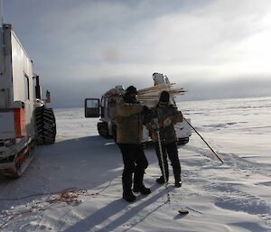 Mark and Gavin drilling ice to place new canes.