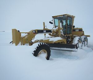 A tractor cover in snow after a blizzard