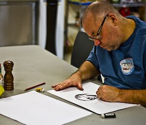 Scotty at the table drawing