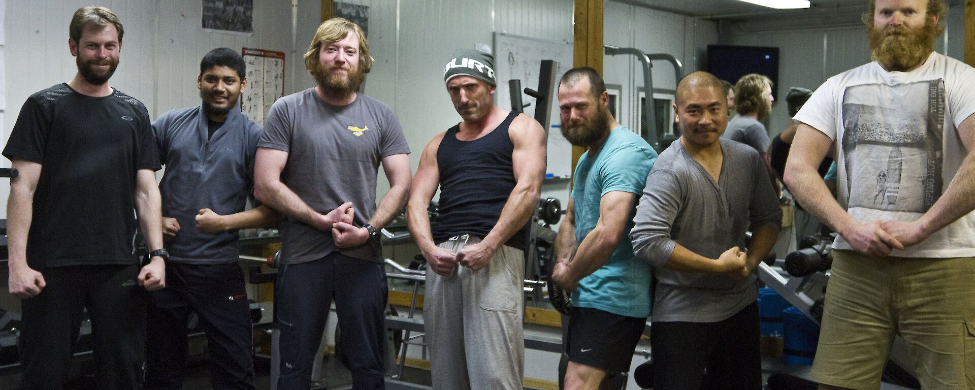Aaron, Abrar, Tim, Lee, Mick, Michael and Matt flexing