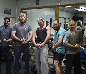 Aaron, Abrar, Tim, Lee, Mick, Michael and Matt flexing